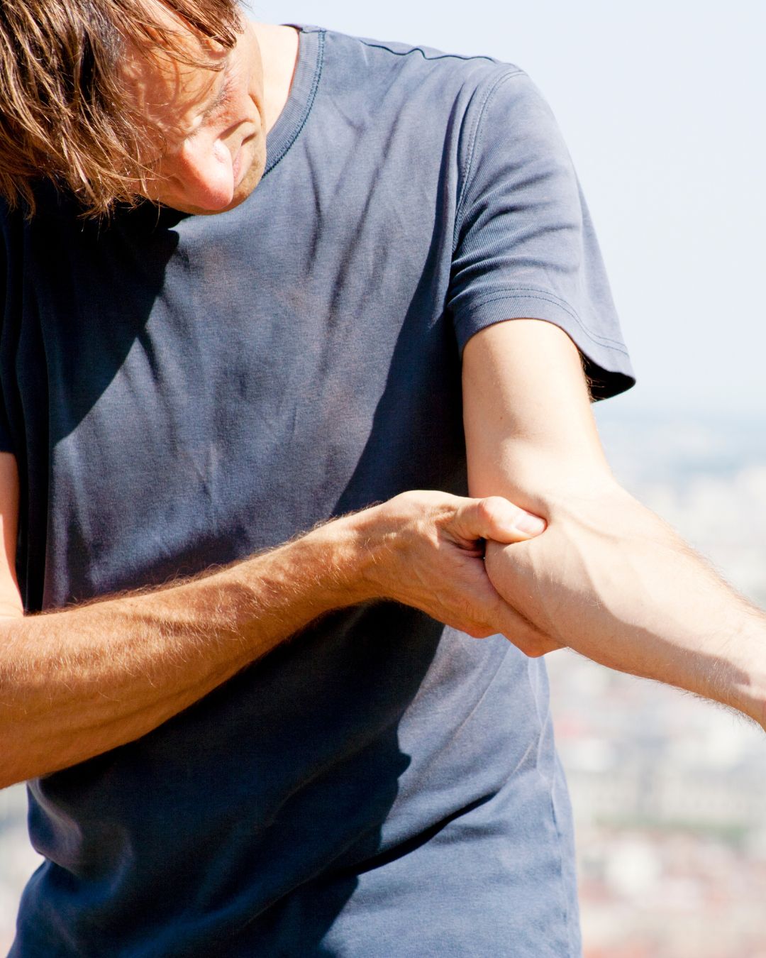 Bend Oregon man with golfers elbow or medial epicondylitis